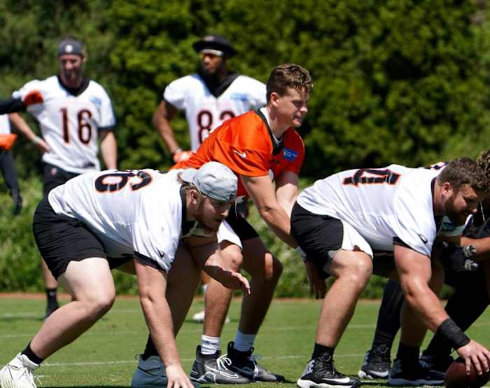 Cincinnati Bengals quarterback Joe Burrow (9) takes a snap during practice, Tuesday, May 17, 2022, at the Paul Brown Stadium practice fields in Cincinnati. Cincinnati Bengals Practice May 17 0106
